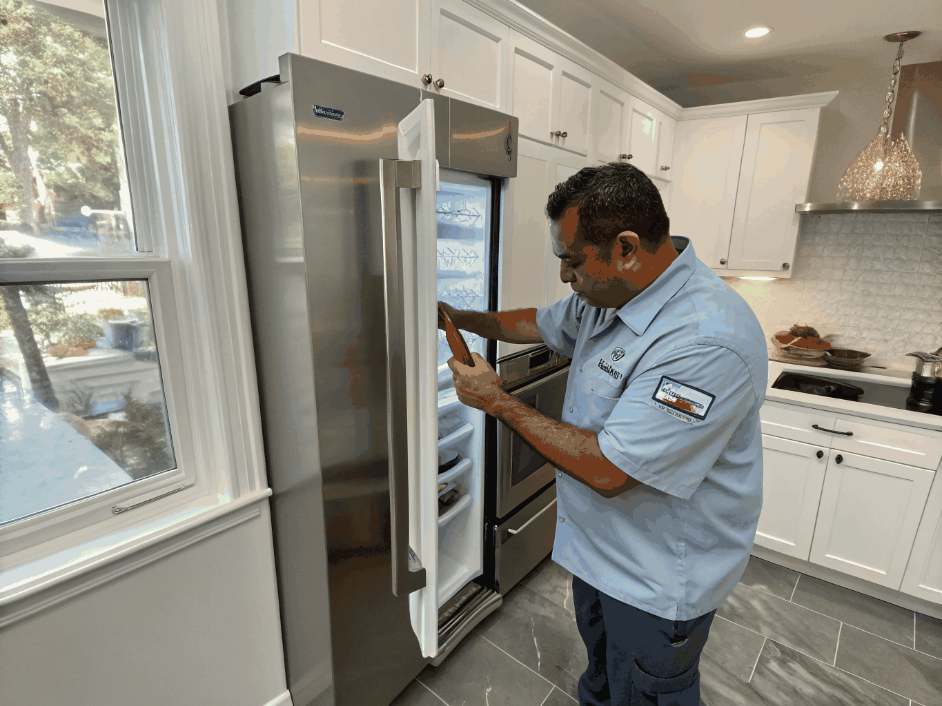 Technician performing monthly ice maker maintenance